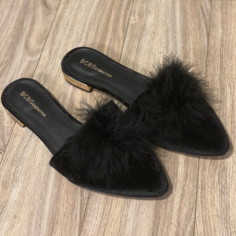 Black BCBG flats with fur ball on top